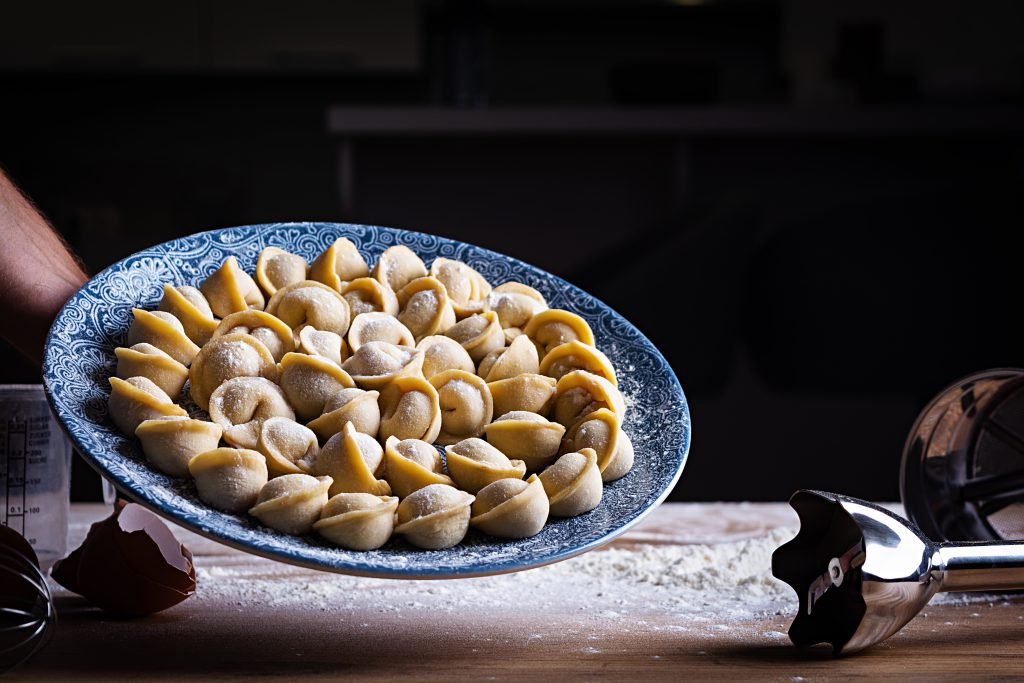 Homemade dumplings, pelmeni, ravioli. Raw russian pelmeni.