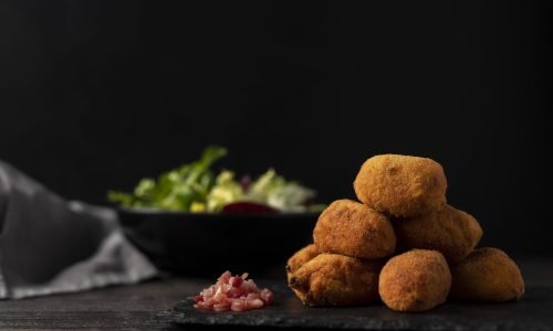 meal-containing-croquettes-with-bacon-salad